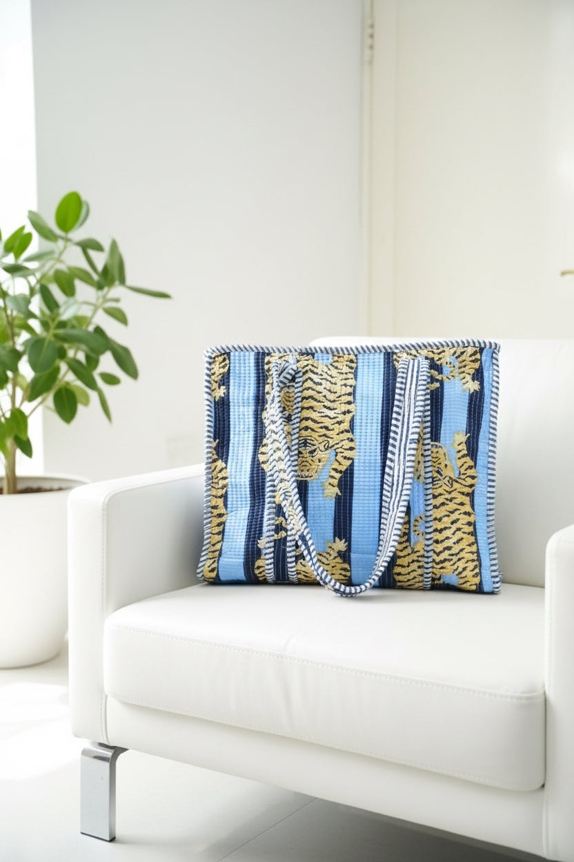 Decorative pillow with blue and yellow pattern on a white couch