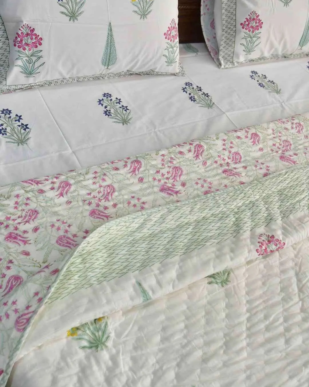 Floral patterned bedding set on a bed