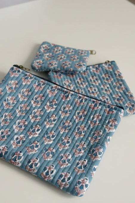 Floral-patterned fabric on a textured surface with floral designs.