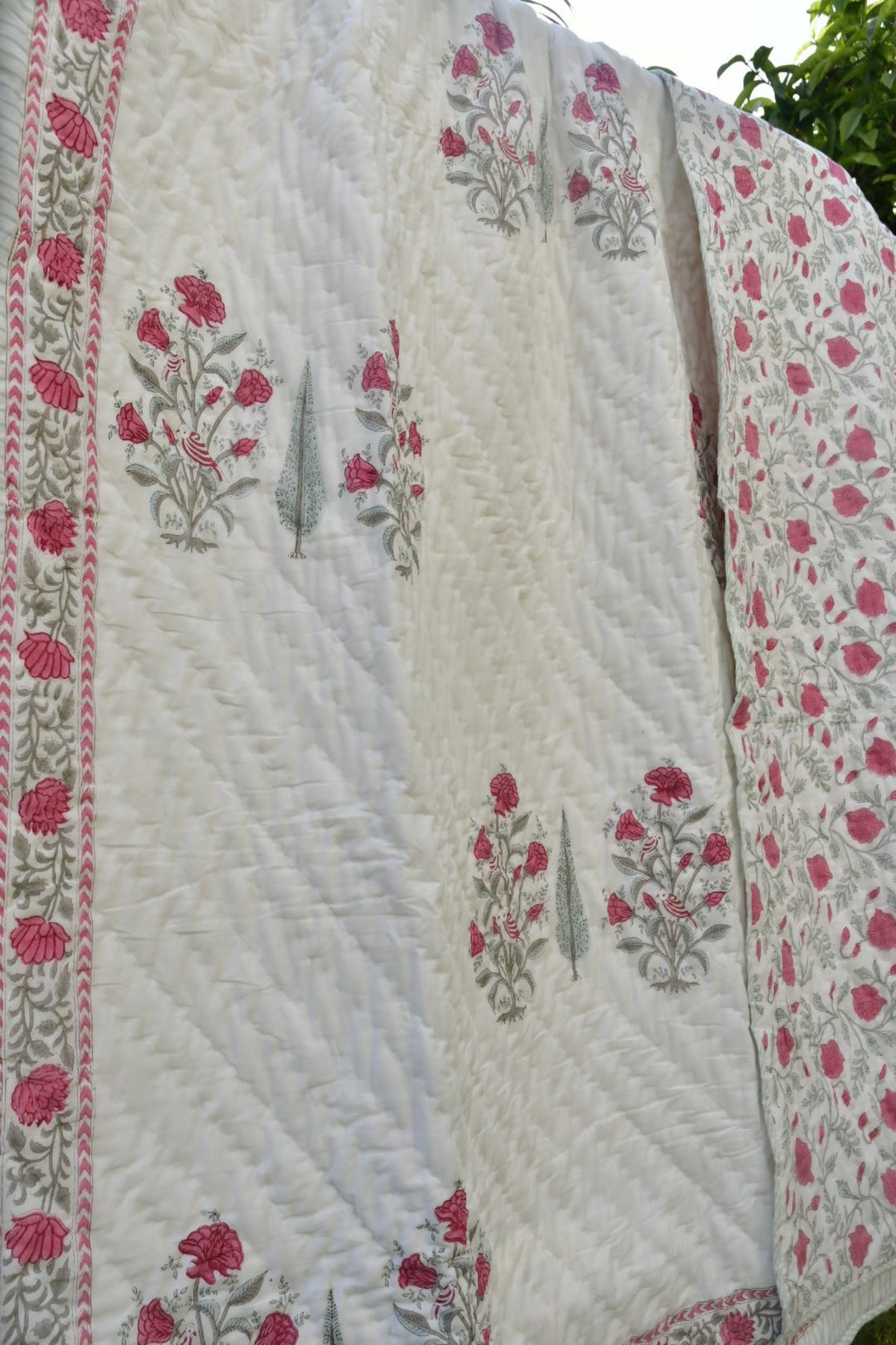 Pink and white quilt