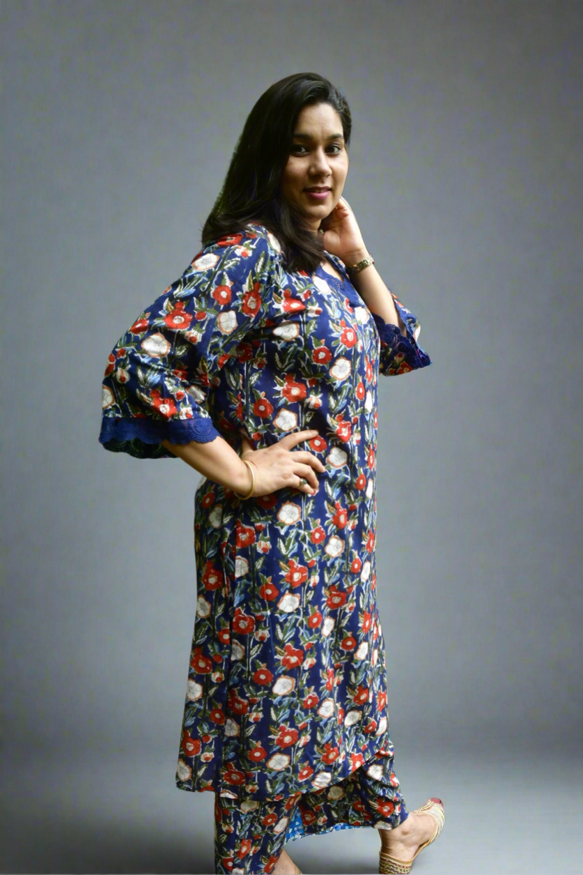 Woman wearing a floral dress against a gray background