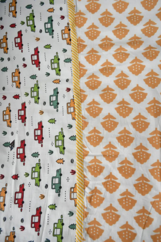 Two fabric dohars with different patterns on a white background