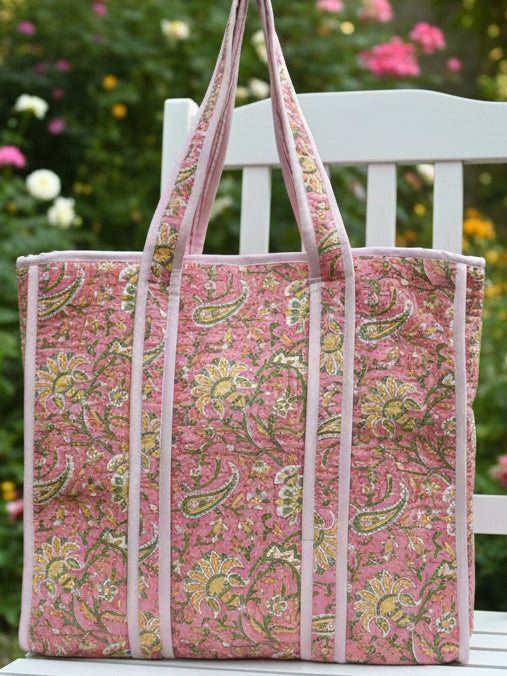 Floral-patterned tote bag on a plain background