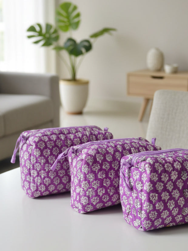 Purple floral-patterned fabric on a table with a blurred background
