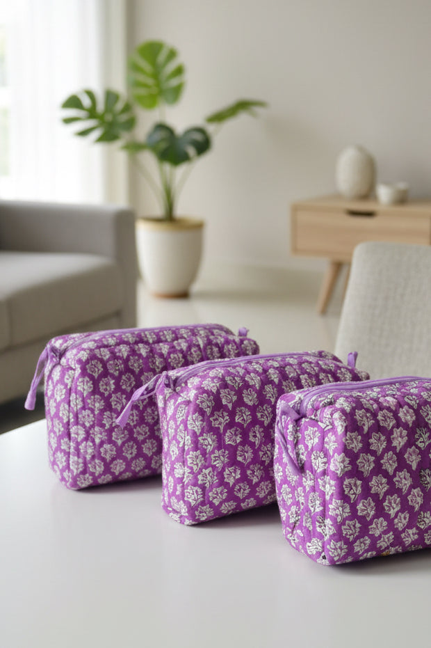 Purple floral-patterned fabric on a table with a blurred background