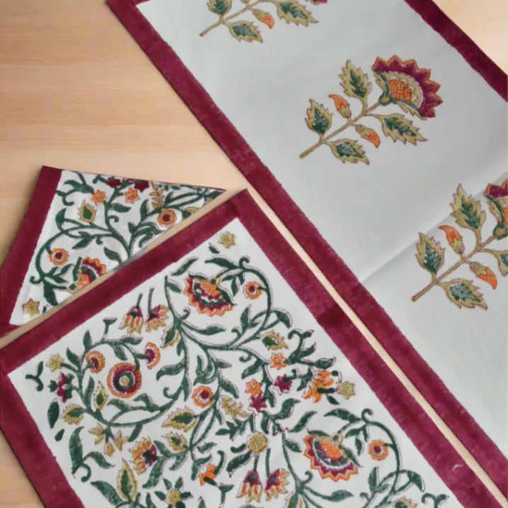 Decorative table runner with floral patterns on a wooden surface