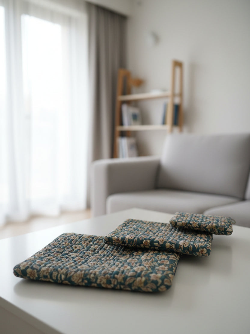 Folded floral-patterned fabric on a bed with floral bedding