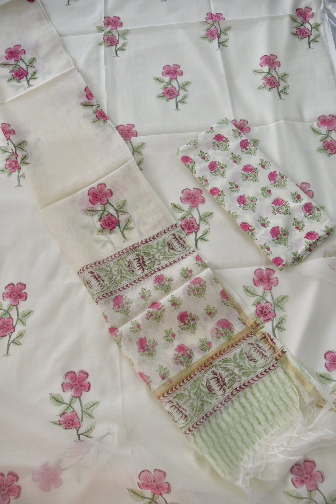 Collection of floral and geometric fabric samples on a white background