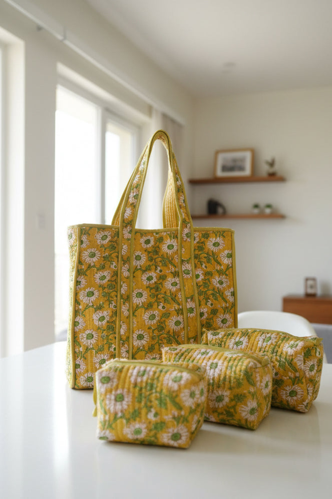 Yellow floral-patterned bags on a floral fabric background