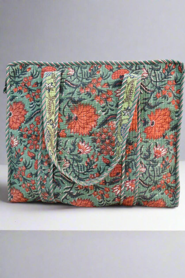 Floral patterned bag with green background