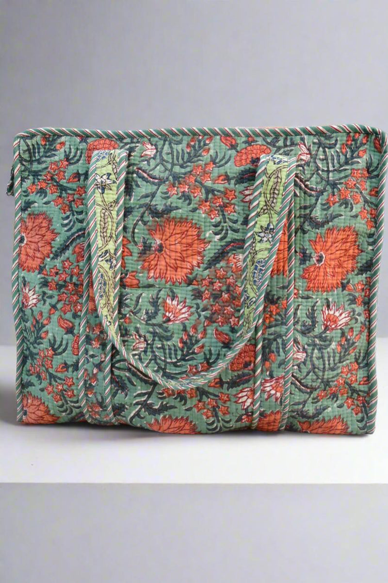 Floral patterned bag with green background