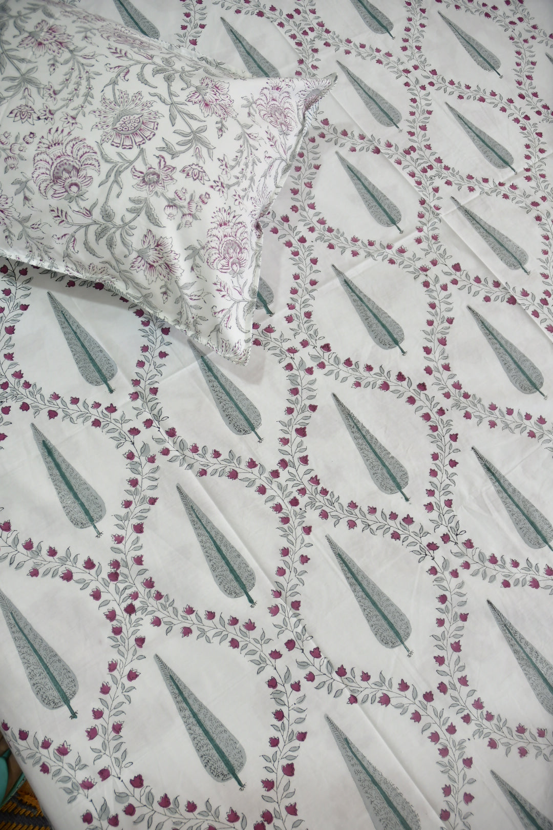 Floral patterned fabric with a pillow on a matching background