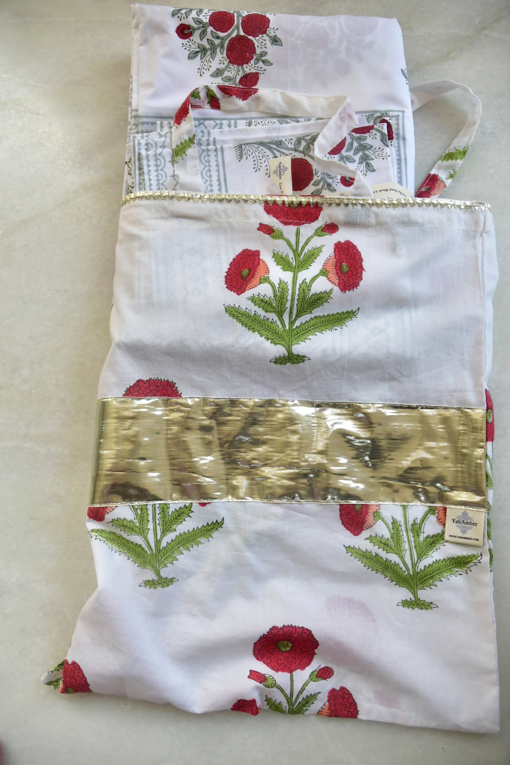 Fabric with floral pattern and text on a plain background