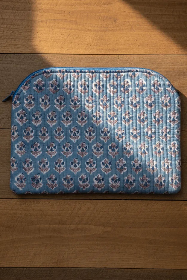 Blue patterned pouch on a wooden surface