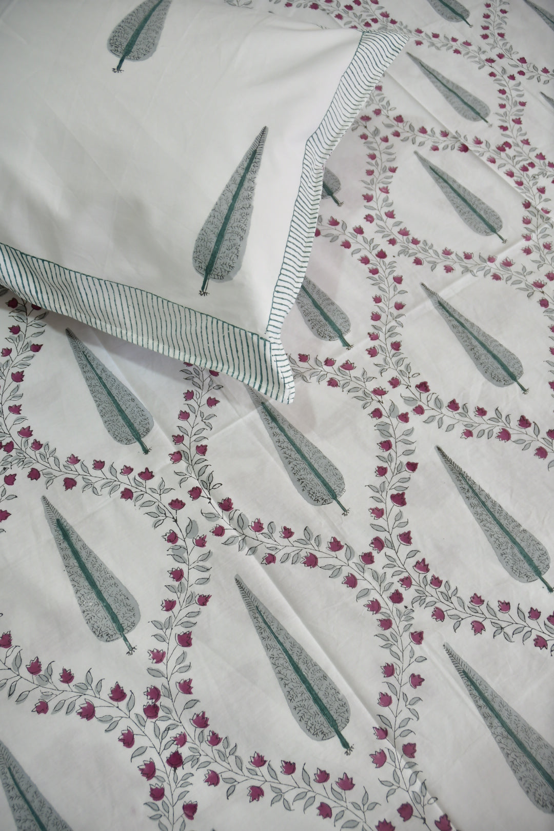 Fabric with feather pattern and striped fabric swatch