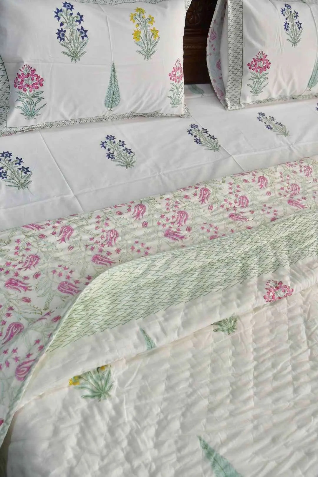 Floral patterned bedding set on a bed