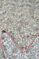 Floral patterned fabric with a pink border