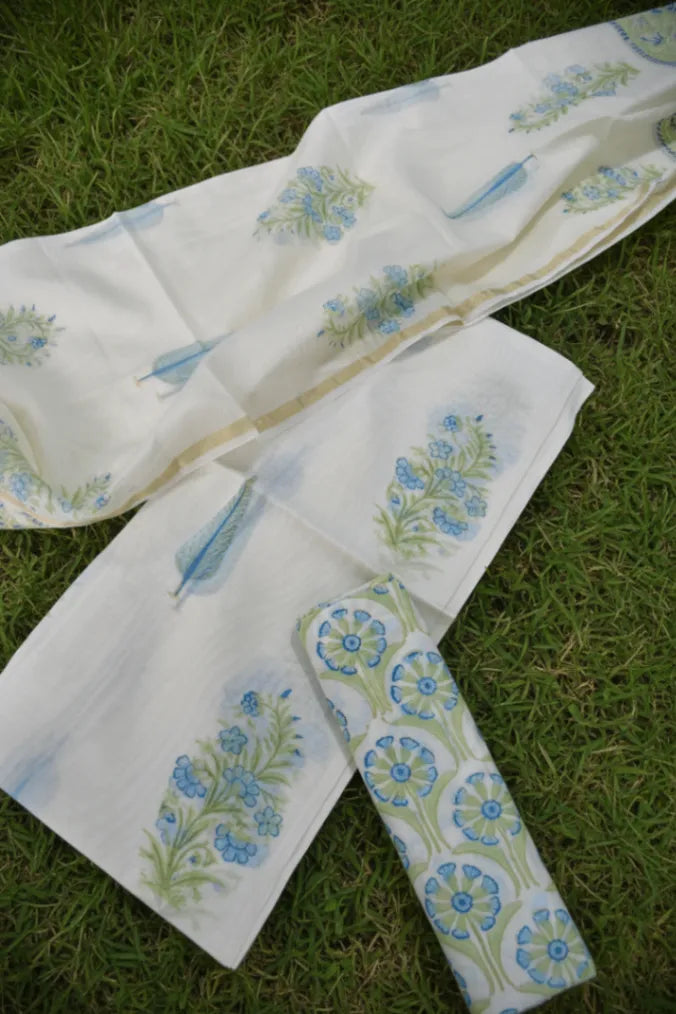 Embroidered fabric with floral patterns on a grass background