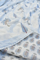 Floral and leaf patterned fabric with blue and white colors