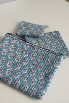 Floral-patterned fabric on a textured surface with floral designs.