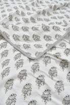 Floral patterned Dohar with a striped border on a white background
