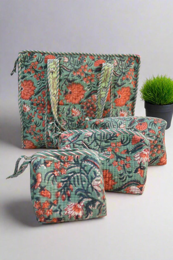 Set of floral-patterned bags on a light gray background