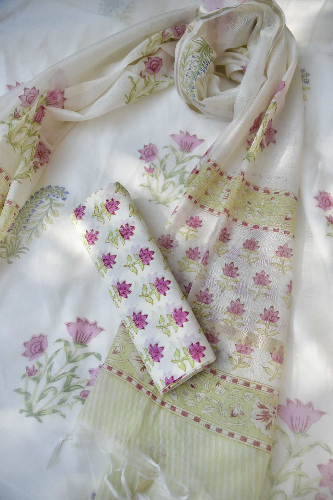 Floral patterned fabric with pink flowers on a white background