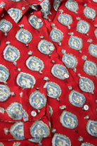 Red fabric with blue and white geometric pattern