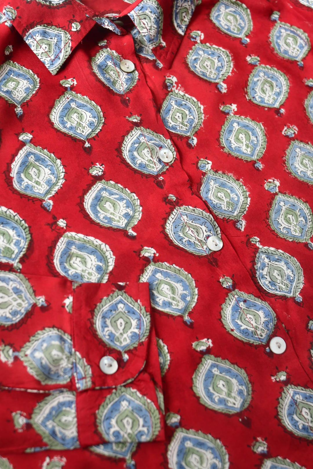 Red fabric with blue and white geometric pattern