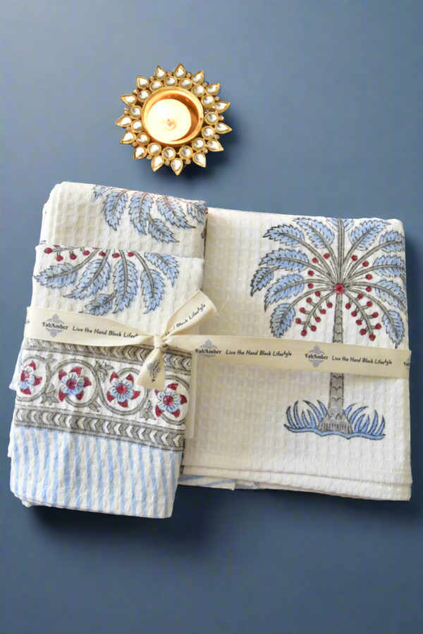 Set of patterned towels with decorative elements on a dark background