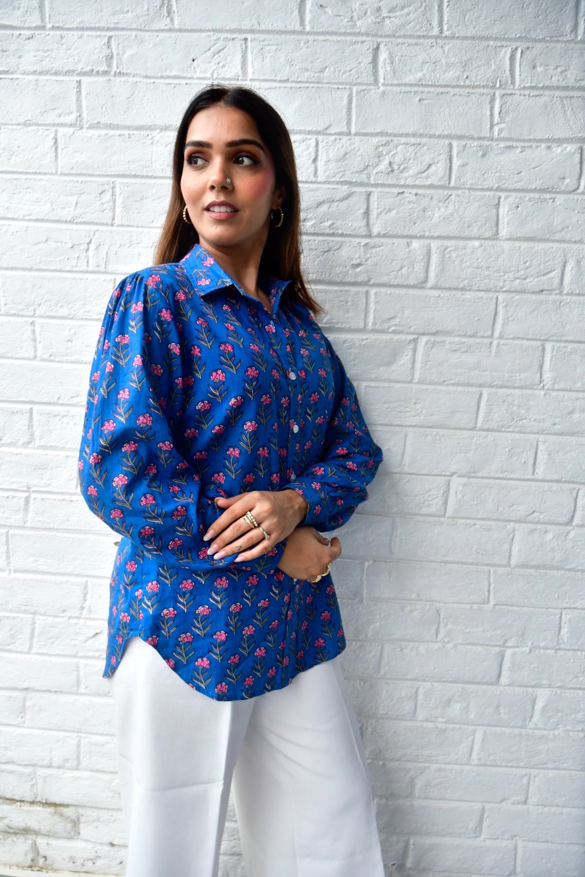 Pink buti on blue shirt