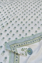 Floral patterned Dohar with green and blue colors on a white background