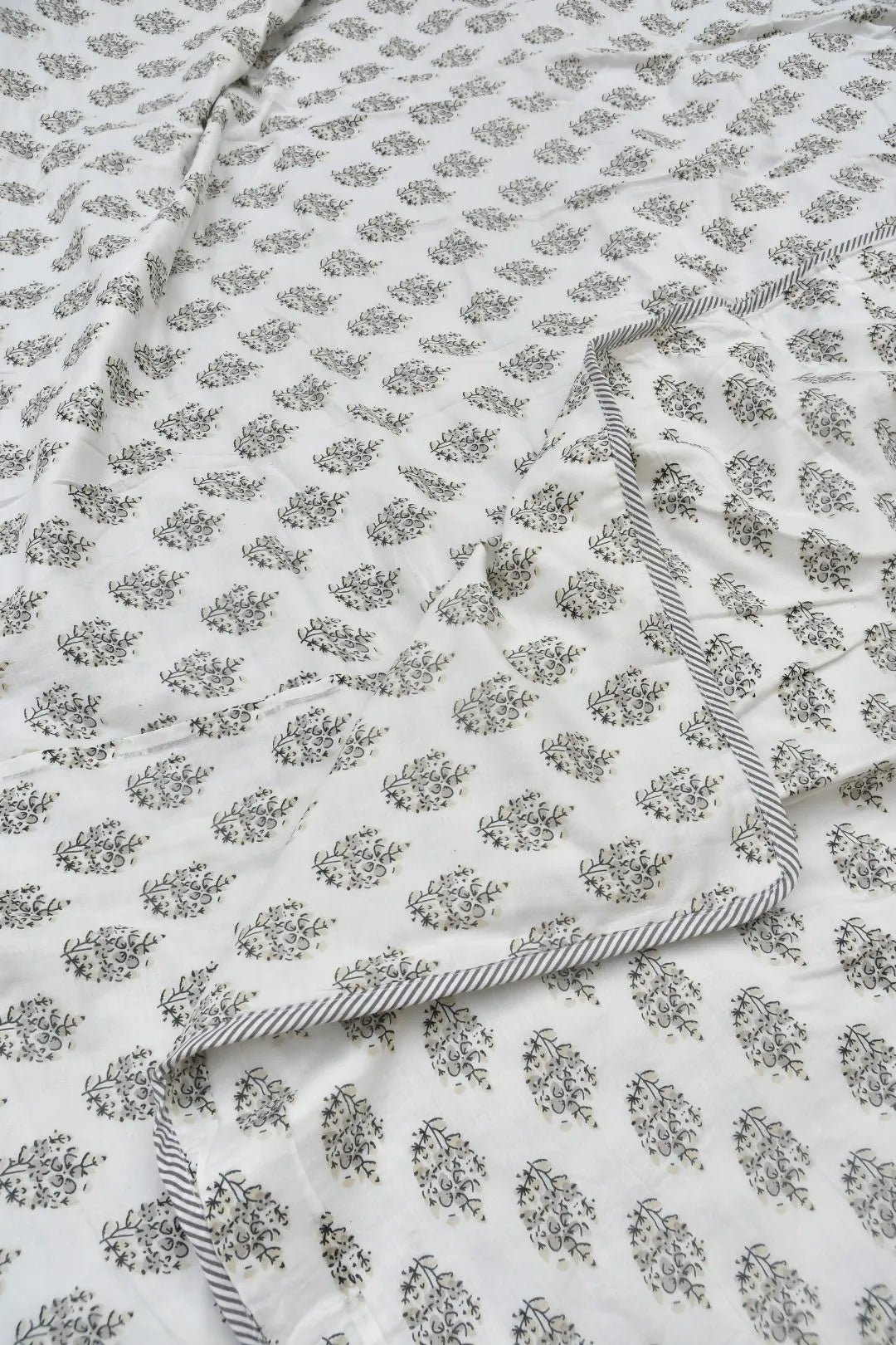 Floral patterned Dohar / blanket with a white background