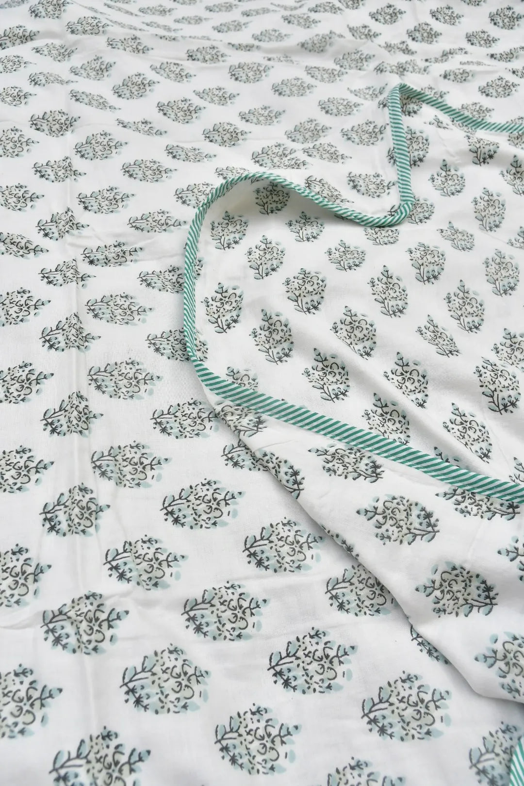 Floral patterned Dohar with a green border on a white background