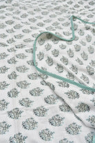 Floral patterned Dohar with a green border on a white background