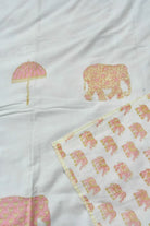 White dohar with pink and gold elephant and umbrella motifs