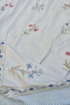 Embroidered Dohar with floral and butterfly designs on a white background