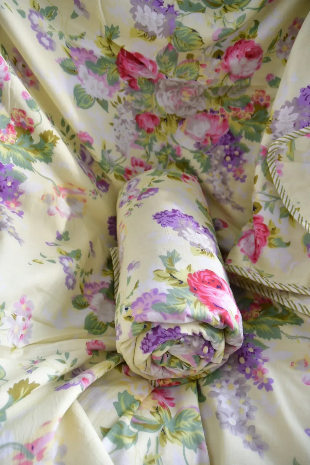 Floral-patterned fabric with a rolled-up section in the center