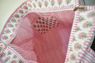Textile product with floral pattern and embroidered heart design