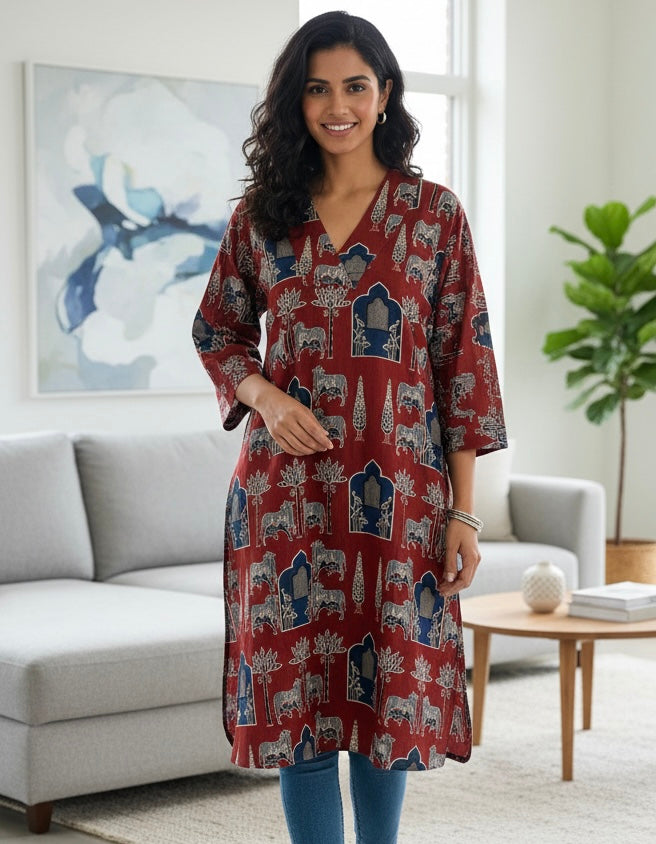 Woman wearing a red patterned dress in a living room setting
