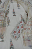 White chanderi with intricate floral patterns in red, green, and blue.