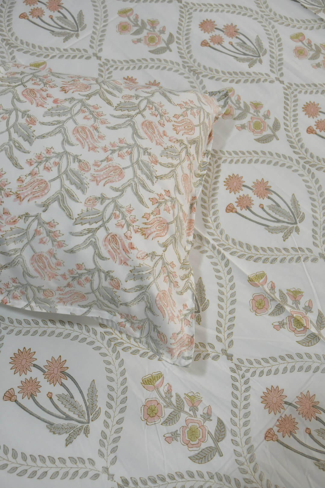 Peach Jaal Buta hand block printed cotton bedsheet with matching pillow covers