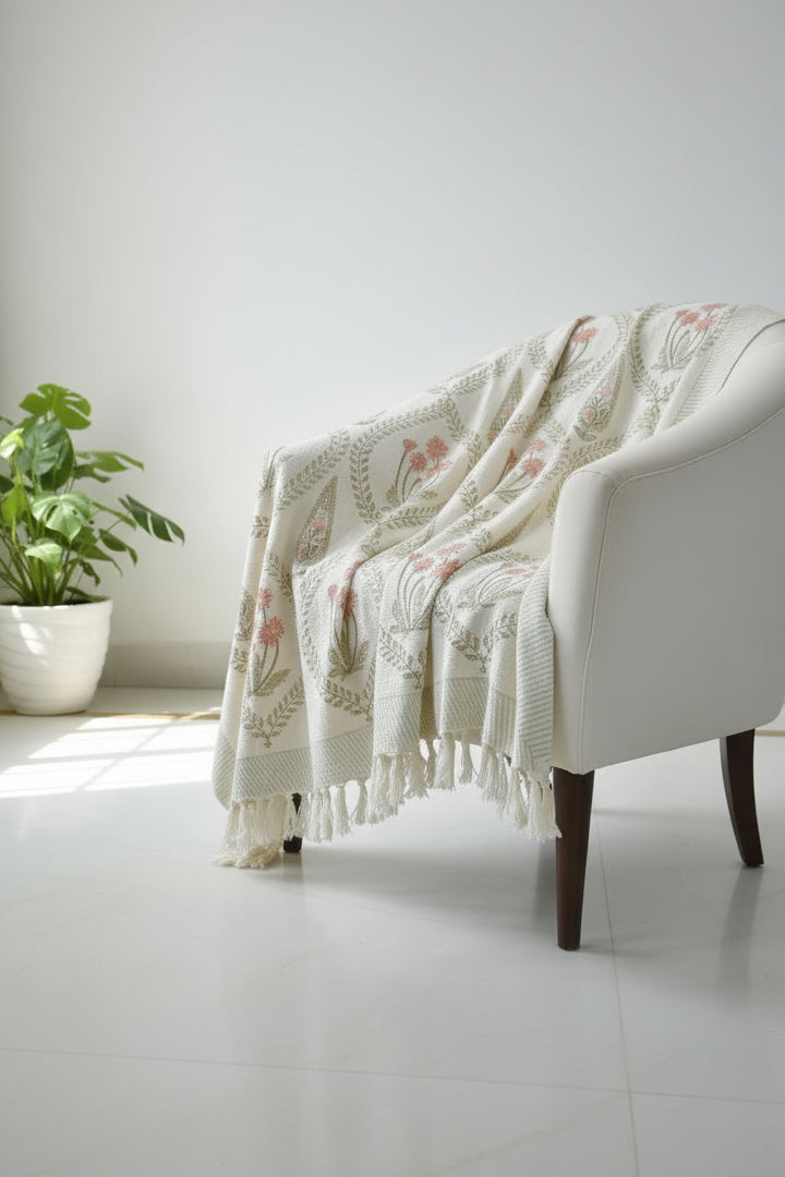 Peach floral throw on white sofa