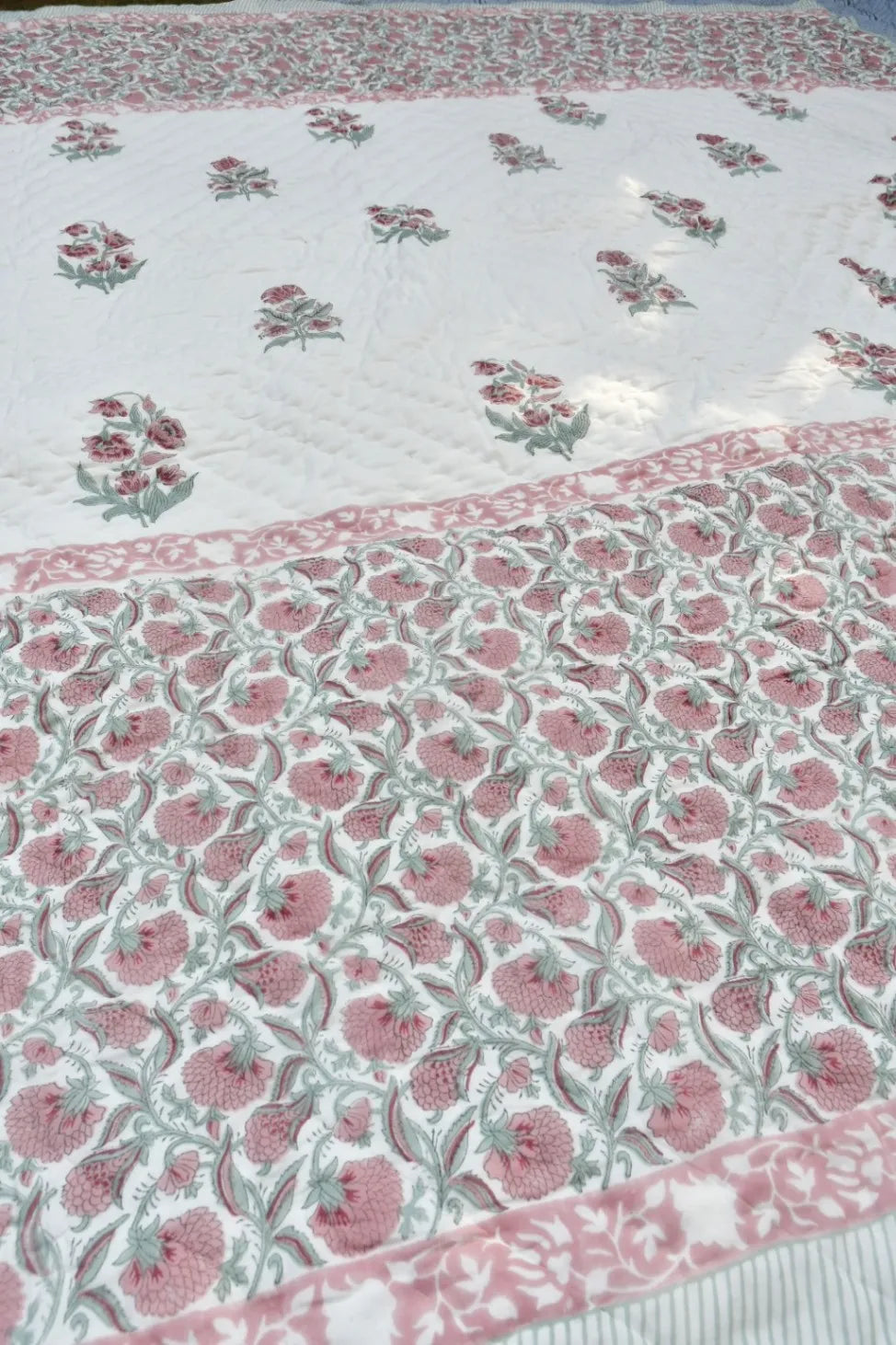 Floral patterned fabric with pink flowers on a white background