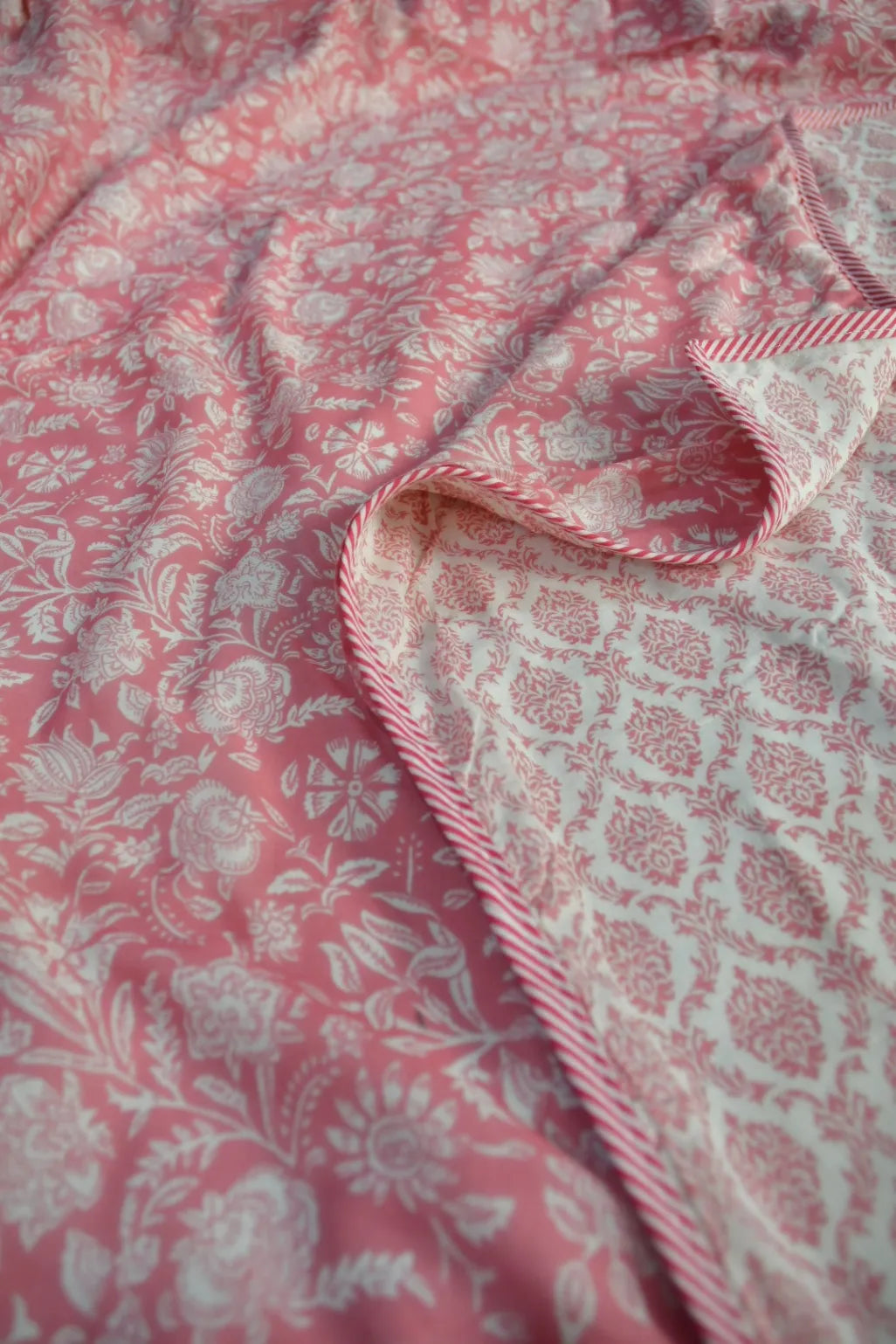 Close-up of pink Dohar with floral pattern