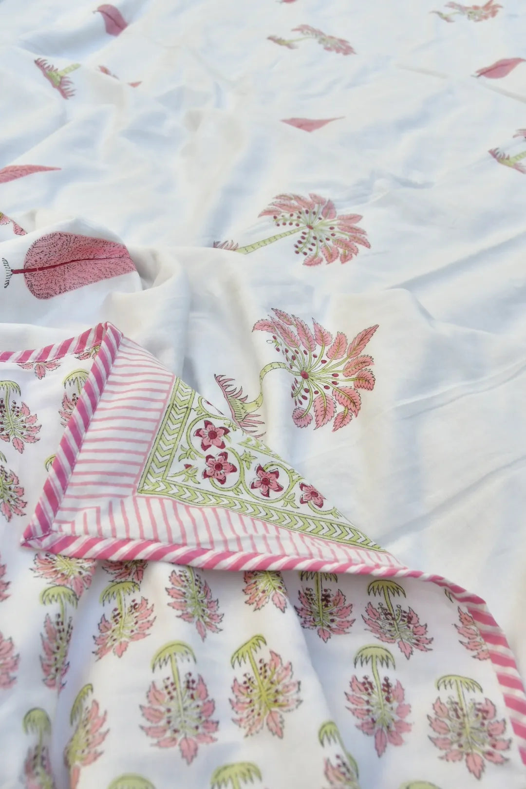 Floral patterned Dohar with pink and green accents on a white background