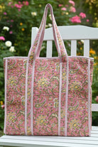 Floral-patterned tote bag on a plain background