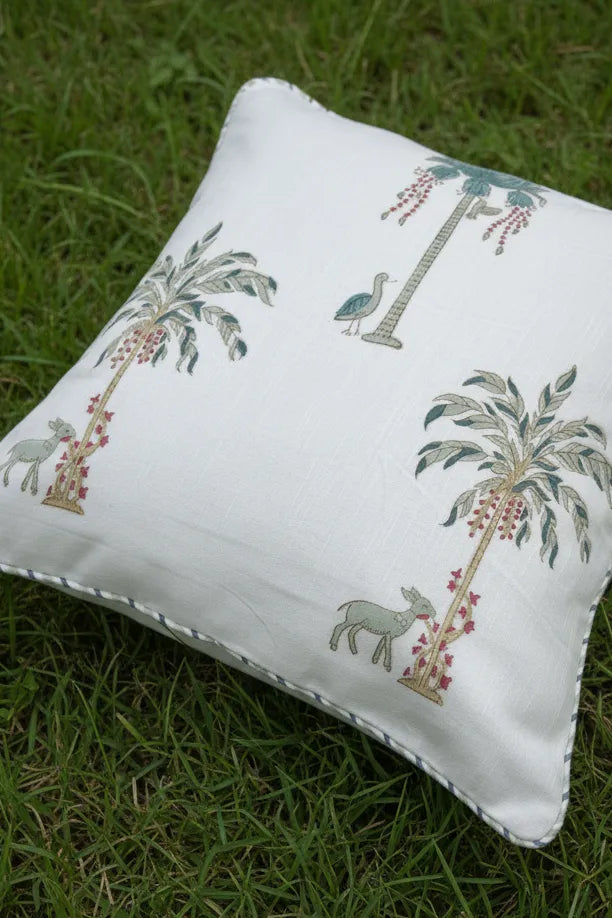 Decorative Cushion cover with palm tree and animal designs on a grass background