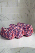 Pink and purple toiletry bags 