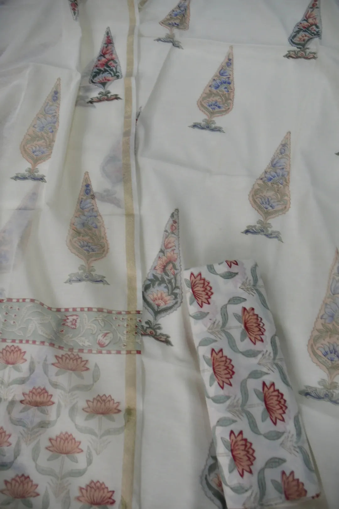 Traditional outfit with floral patterns on a white background